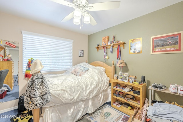 bedroom featuring ceiling fan and carpet