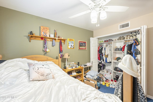 bedroom featuring ceiling fan and a closet