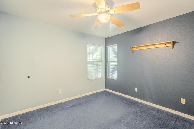 spare room with ceiling fan and carpet floors