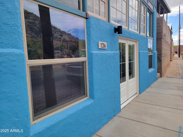 126 Naco Rd, Bisbee, AZ 85603 - doorway to property featuring stucco siding