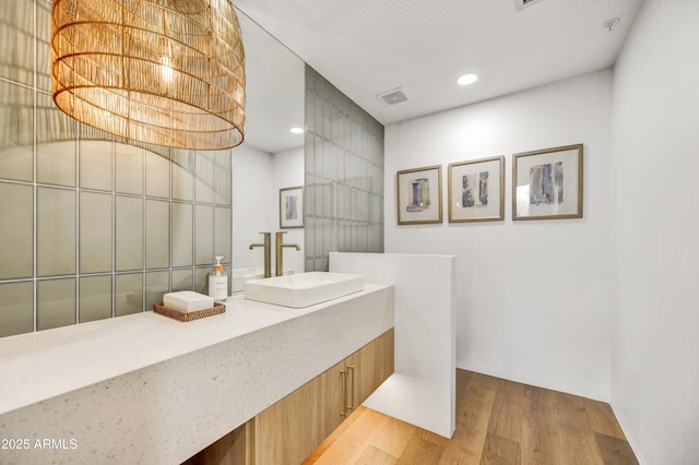 bathroom featuring wood-type flooring and vanity