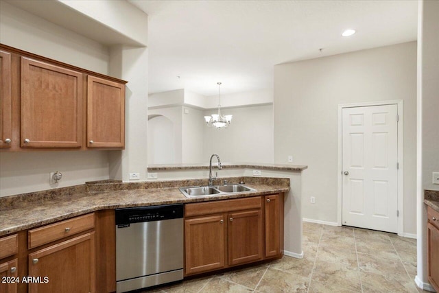 kitchen with stainless steel dishwasher, sink, decorative light fixtures, and a notable chandelier