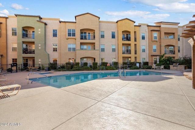 view of pool featuring a patio