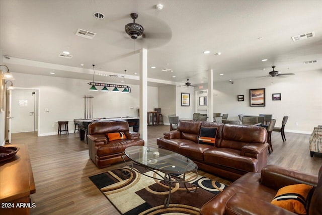 living room featuring ceiling fan and wood-type flooring