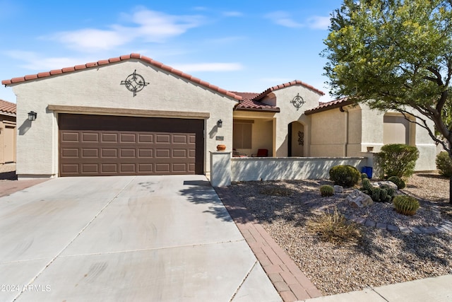 mediterranean / spanish-style house featuring a garage