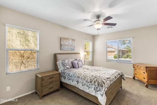 carpeted bedroom with ceiling fan