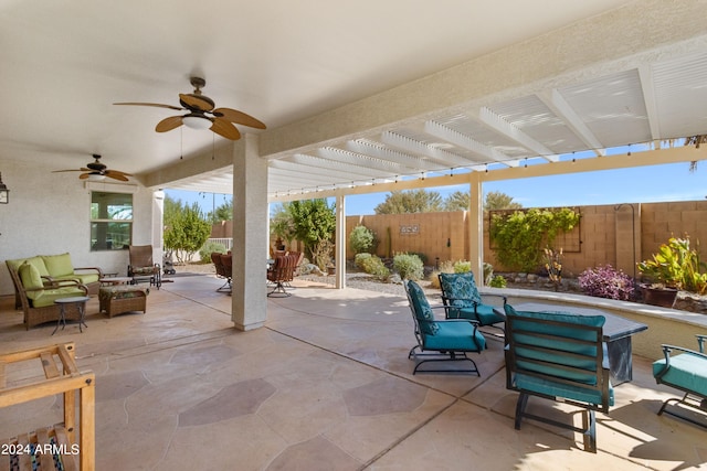 view of patio with a pergola, ceiling fan, and an outdoor hangout area