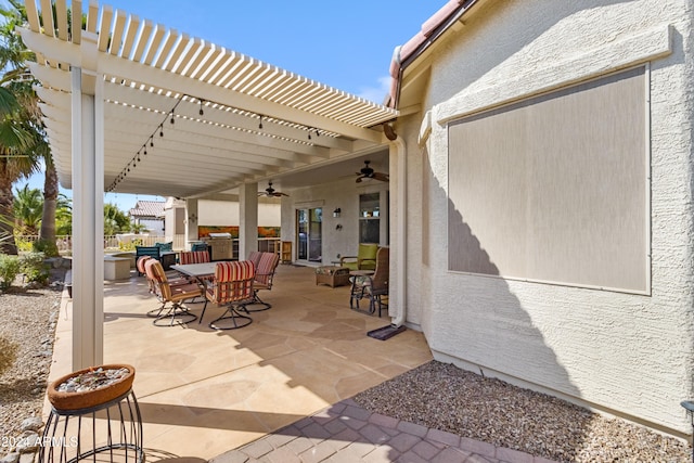 view of patio / terrace with a pergola and ceiling fan