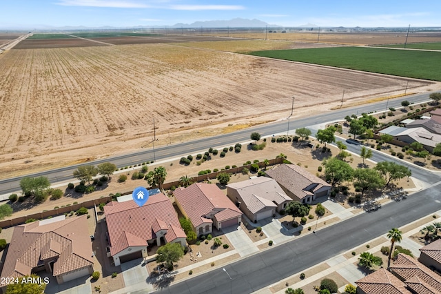 birds eye view of property with a rural view