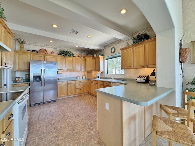 kitchen with beam ceiling, white electric range oven, visible vents, a peninsula, and stainless steel fridge with ice dispenser