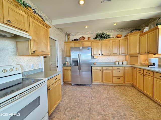 kitchen featuring under cabinet range hood, electric range, light countertops, stainless steel fridge with ice dispenser, and wallpapered walls