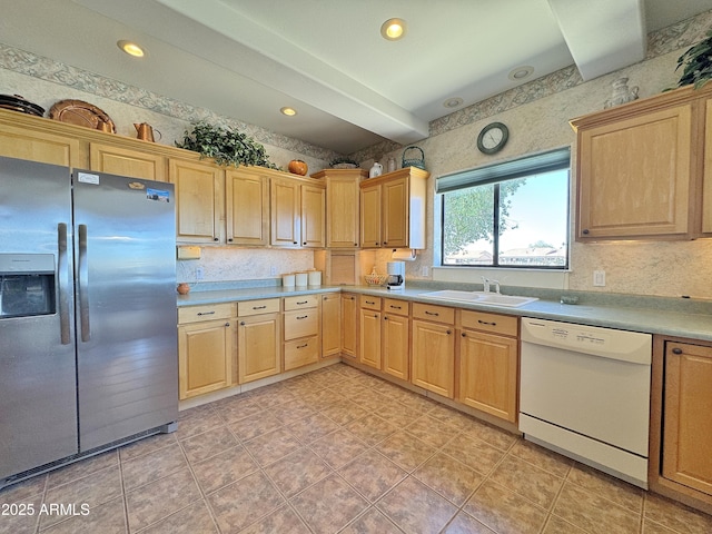 kitchen featuring a sink, light countertops, stainless steel fridge with ice dispenser, dishwasher, and light brown cabinetry