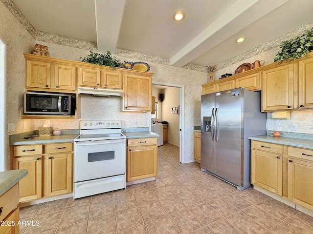 kitchen featuring washer / dryer, beamed ceiling, light countertops, stainless steel appliances, and under cabinet range hood