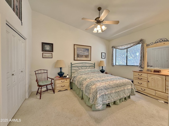 bedroom featuring carpet floors, a ceiling fan, vaulted ceiling, and a closet