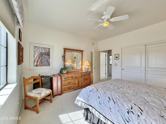 bedroom featuring a closet, carpet flooring, and ceiling fan