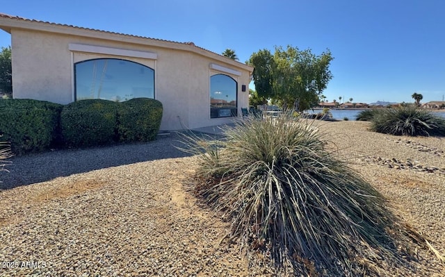 view of side of property featuring stucco siding