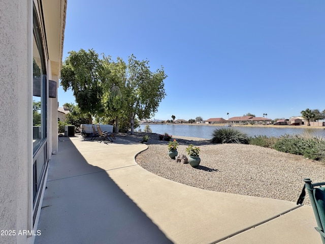 view of patio / terrace with a water view