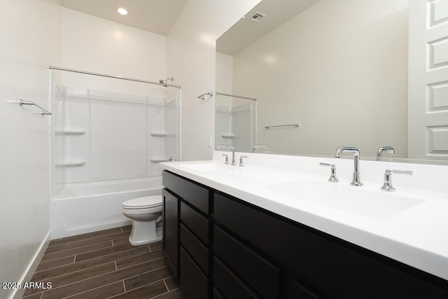 full bathroom with vanity, bathtub / shower combination, and toilet