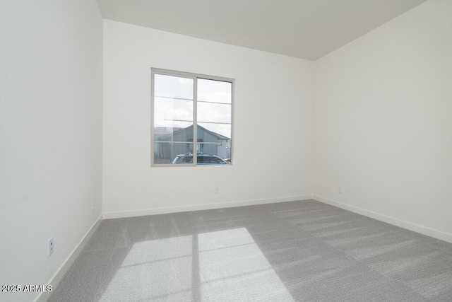 unfurnished room featuring carpet flooring