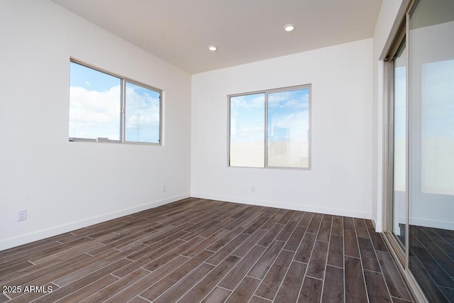 spare room with dark wood-type flooring