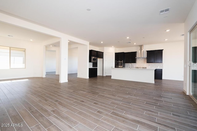 unfurnished living room featuring dark hardwood / wood-style flooring