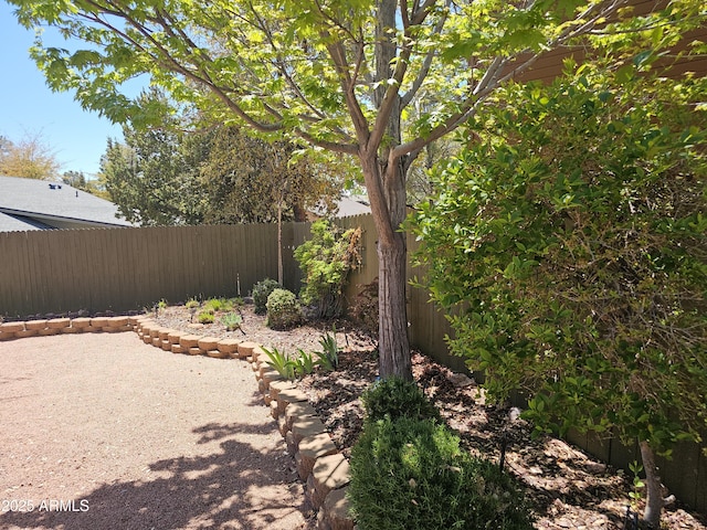 fenced backyard with a patio area