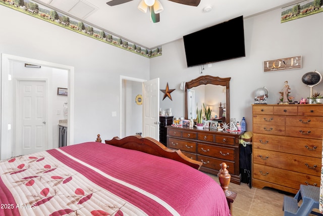 bedroom with ceiling fan, ensuite bathroom, and light tile patterned floors