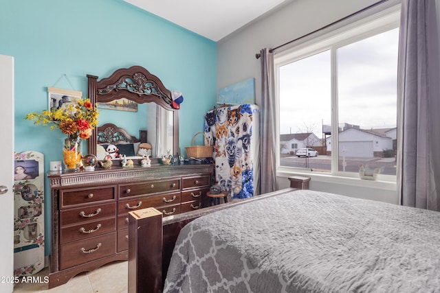 bedroom with light tile patterned flooring