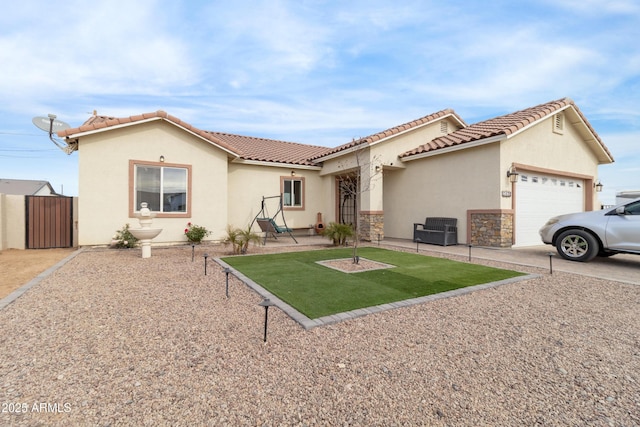 view of front of property featuring stucco siding, concrete driveway, an attached garage, stone siding, and a tiled roof