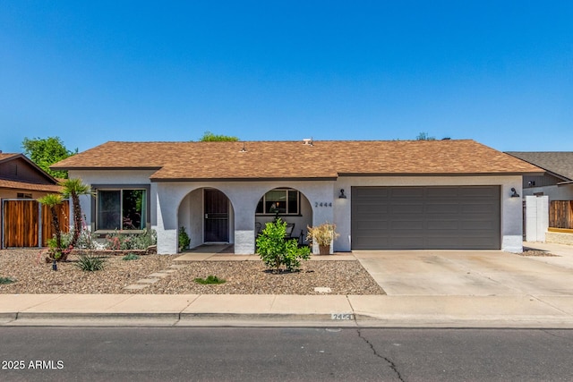 2444 S Noche De Paz, Mesa, AZ 85202 - ranch-style home featuring stucco siding, an attached garage, driveway, and a shingled roof