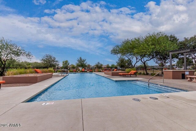 view of pool featuring a patio area and a pergola