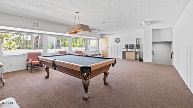 recreation room featuring pool table, carpet, and a textured ceiling