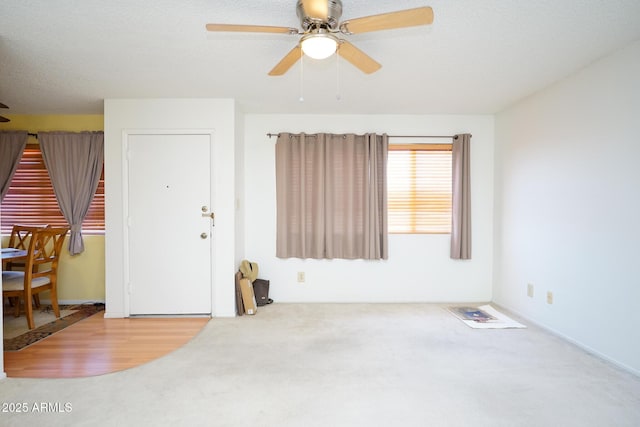 10018 N 97th Dr Unit A, Peoria, AZ 85345 - carpeted entryway with a ceiling fan