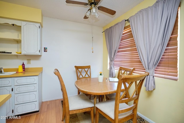 10018 N 97th Dr Unit A, Peoria, AZ 85345 - dining space with ceiling fan and light wood finished floors
