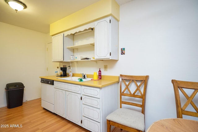 10018 N 97th Dr Unit A, Peoria, AZ 85345 - kitchen featuring dishwasher, open shelves, light wood-type flooring, light countertops, and white cabinetry