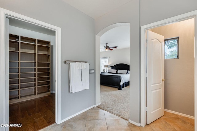 17562 W Agave Ct, Goodyear, AZ 85338 - corridor with arched walkways and baseboards