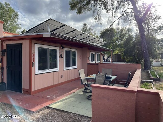 exterior space with outdoor dining space and a patio