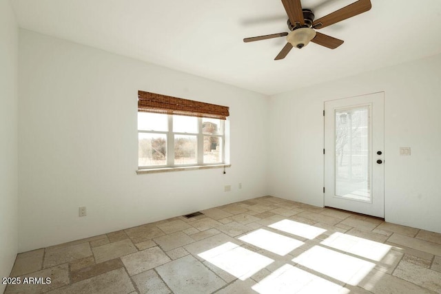 unfurnished room featuring ceiling fan