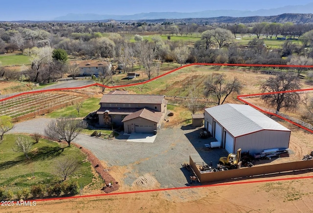 aerial view featuring a rural view and a mountain view