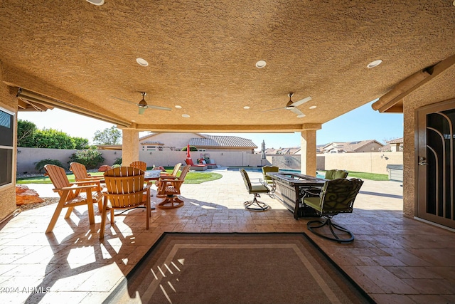 view of patio / terrace featuring ceiling fan