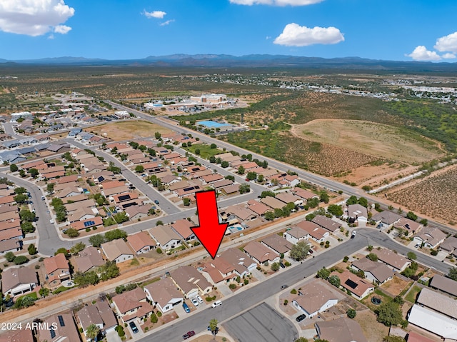 birds eye view of property with a mountain view