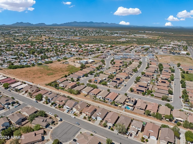 birds eye view of property with a mountain view