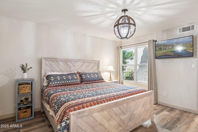 8787 E Mountain View Rd Unit 2100, Scottsdale, AZ 85258 - bedroom with wood finished floors and baseboards