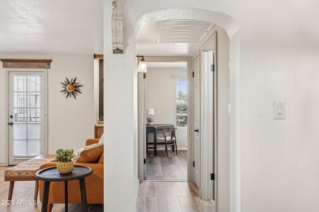 8787 E Mountain View Rd Unit 2100, Scottsdale, AZ 85258 - corridor with wood finished floors, arched walkways, and plenty of natural light