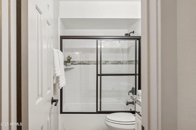 8787 E Mountain View Rd Unit 2100, Scottsdale, AZ 85258 - bathroom featuring toilet, vanity, and combined bath / shower with glass door