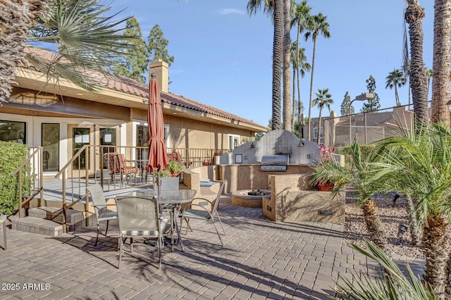 8787 E Mountain View Rd Unit 2100, Scottsdale, AZ 85258 - view of patio / terrace with outdoor dining space and a fire pit