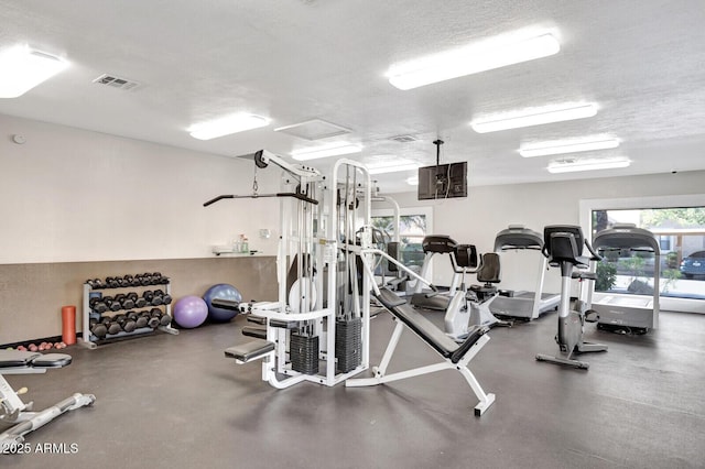8787 E Mountain View Rd Unit 2100, Scottsdale, AZ 85258 - workout area with a textured ceiling