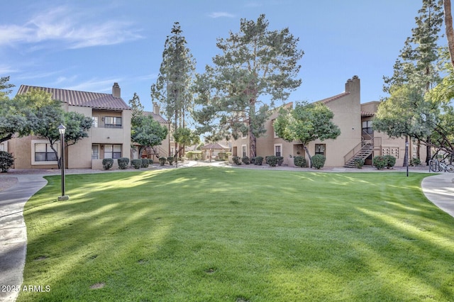 8787 E Mountain View Rd Unit 2100, Scottsdale, AZ 85258 - surrounding community with a lawn, a residential view, and stairs