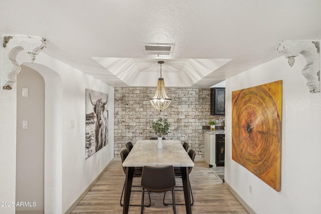 8787 E Mountain View Rd Unit 2100, Scottsdale, AZ 85258 - dining space with light wood-type flooring and arched walkways