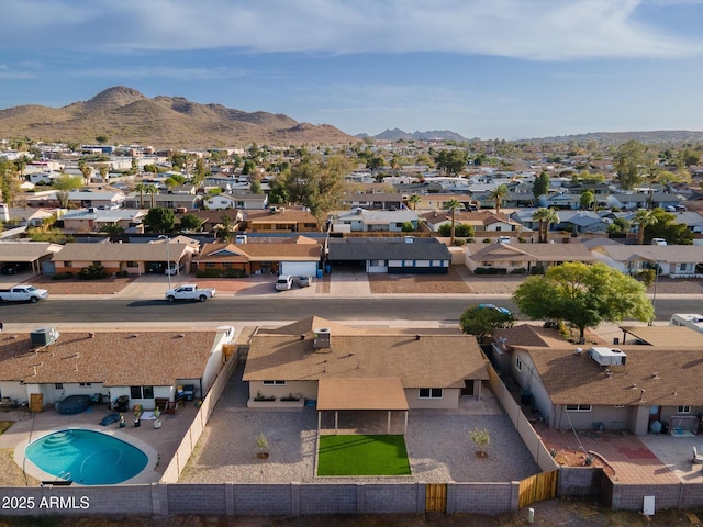 birds eye view of property featuring a mountain view and a residential view